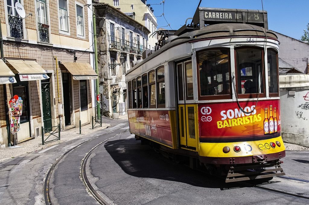 Tram 28 driving through Lisbon's Alfama district 