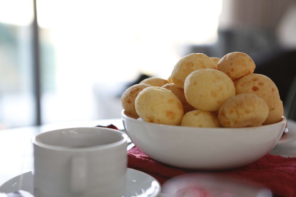 a bowl of Pão de queijo cheese bread balls