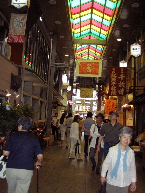 Kyoto Private Tour - In the Nishiki Market, you can buy fresh sea food, Kyoto-brand vegetables,pickles, kitchen tools (kettles, knives, basekts and so on) and handicrafts. This narrow street lasts about 400 meters. This market is always busy and active. In the market we eat sushi lunch.