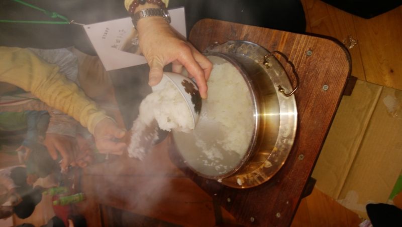 Niigata Private Tour - cooking koshihikari rice in a traditional iron pot. 