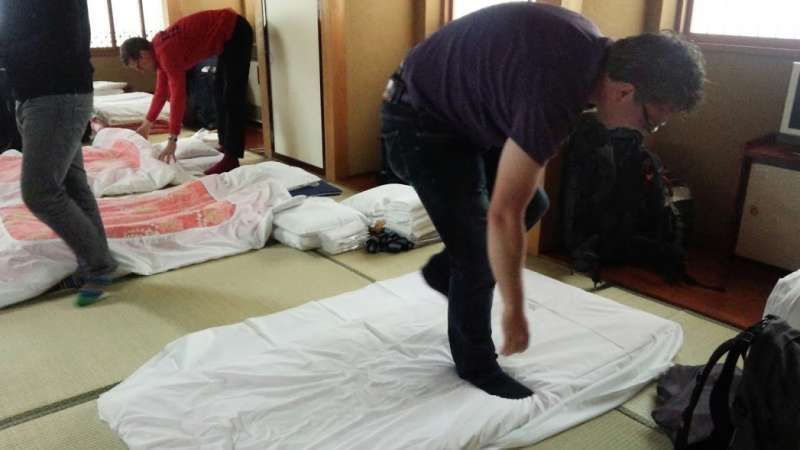 Kanagawa Private Tour - European tourists who are making a Japanese bed on Tatami floor in Shukubo, a hospicea guesthouse kept by a temple, at Zenkoji Buddist temple in Nagano prefecture.