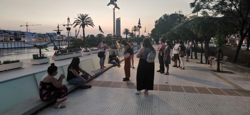 Andalucia Private Tour - Guiding a group in the Columbus Avenue near by the river, Sevilla