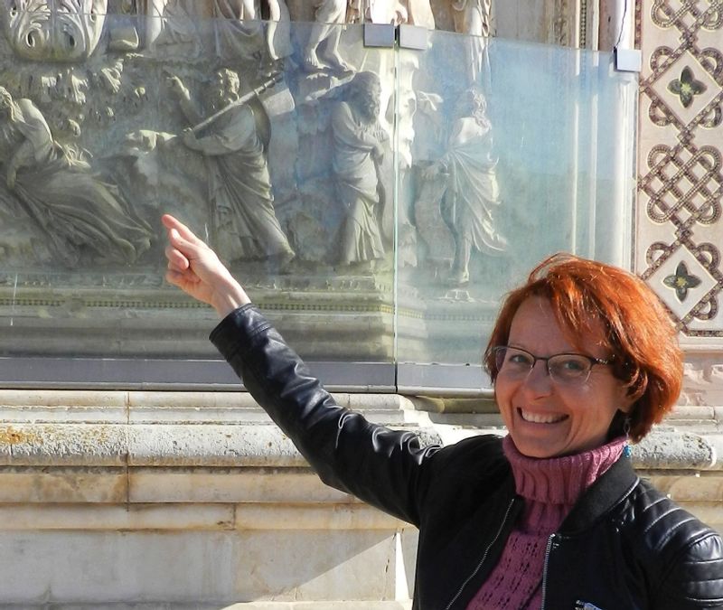 Florence Private Tour - In Orvieto, illustrating the cathedral's reliefs