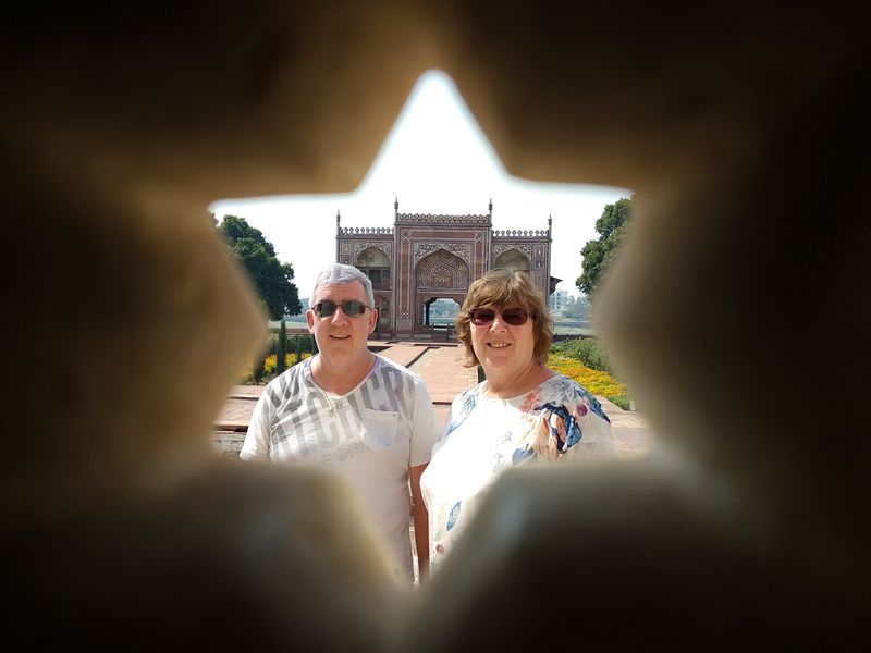 Agra Private Tour - A creative picture of this couple through a fancing (Jali) at Baby Taj