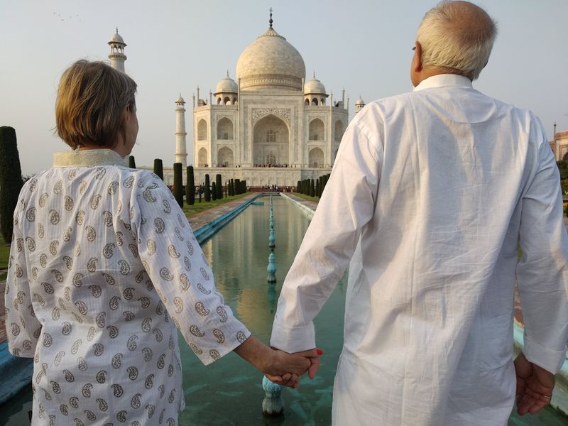 Agra Private Tour - A couple admiring the beauty of Taj Mahal