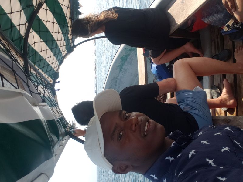 Zanzibar Private Tour - A private boat with guests watching the Dolphins