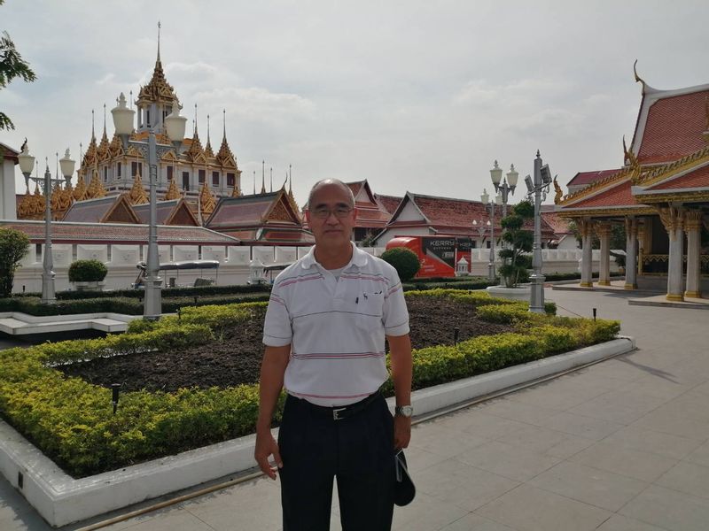 Bangkok Private Tour - At the city pavilion with Loha Prasat in the background.