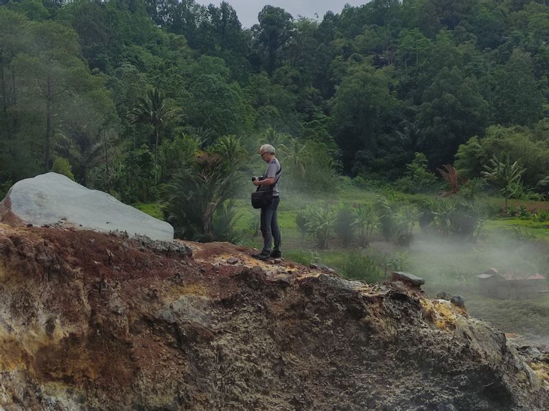 North Sulawesi Private Tour - My client (pro photographer) is looking at the natural sulphuric well