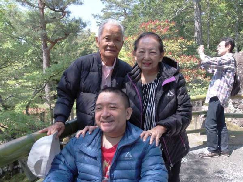 Osaka Private Tour - His parents push his wheelchair together