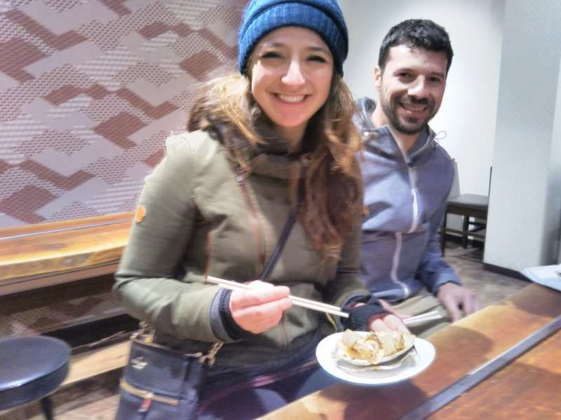 Osaka Private Tour - A couple from New Orleans trying Takoyaki 