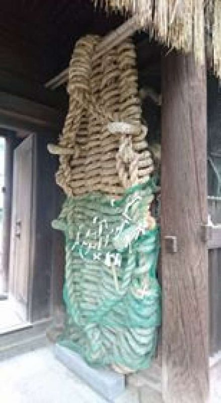 Ehime Private Tour - Big Sandal at the gate of Ishite-ji Temple. It will bring you strength if you touch it. Every four year, in a leap year, it is burned and replaced by a new one. It takes 3 days when 30 people are engaged in making the sandal.