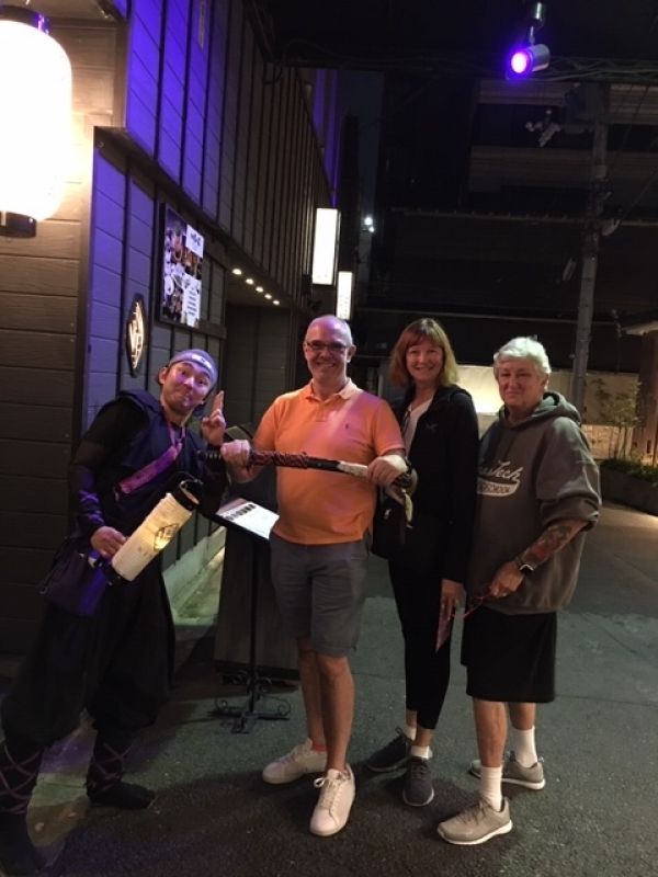 Kobe Private Tour - Nice group striking a pose in front of a Ninjya restaurant downtown Kyoto