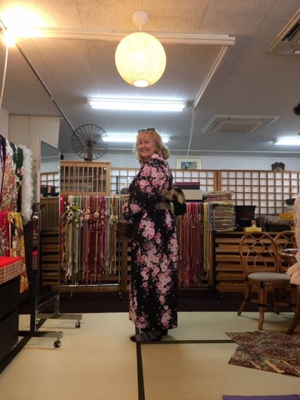 Kobe Private Tour - Looks like the Mona Lisa in kimono!! Yes, indeed!! A lady dressed in a vivid Yukata (light kimono) at a long-established kimono shop in Himeji castle town.