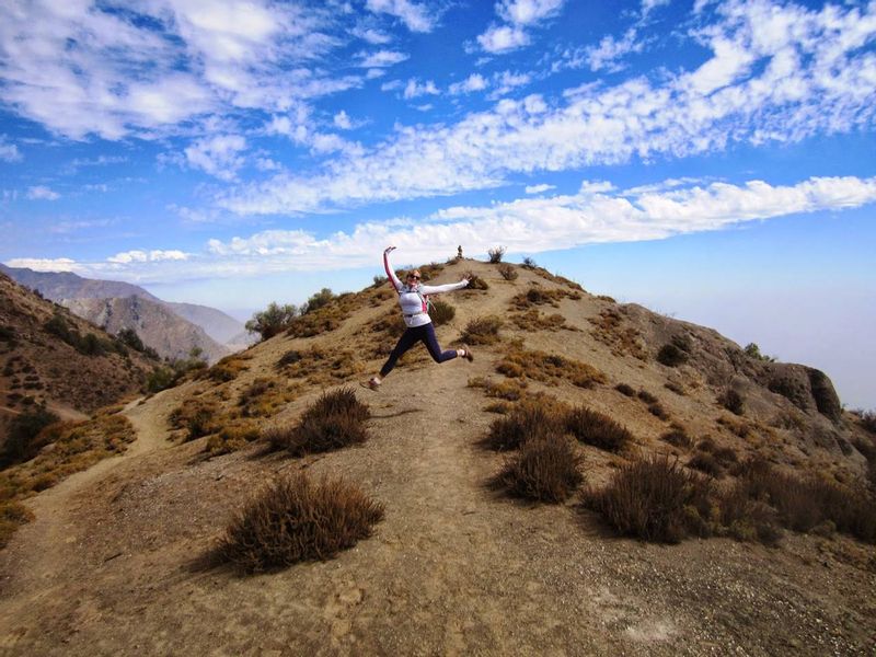 Santiago Private Tour - Happy client enjoying the hike up to Alto el Naranjo.