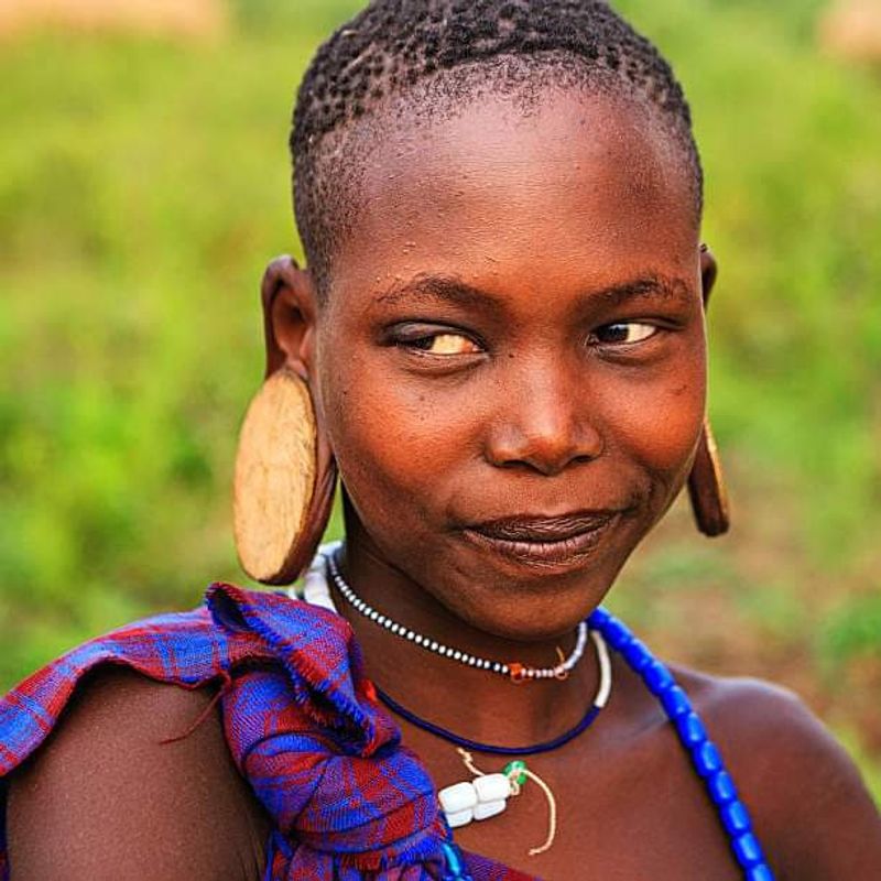 Addis Ababa Private Tour - Young mursi girl with her wooden ear ring.