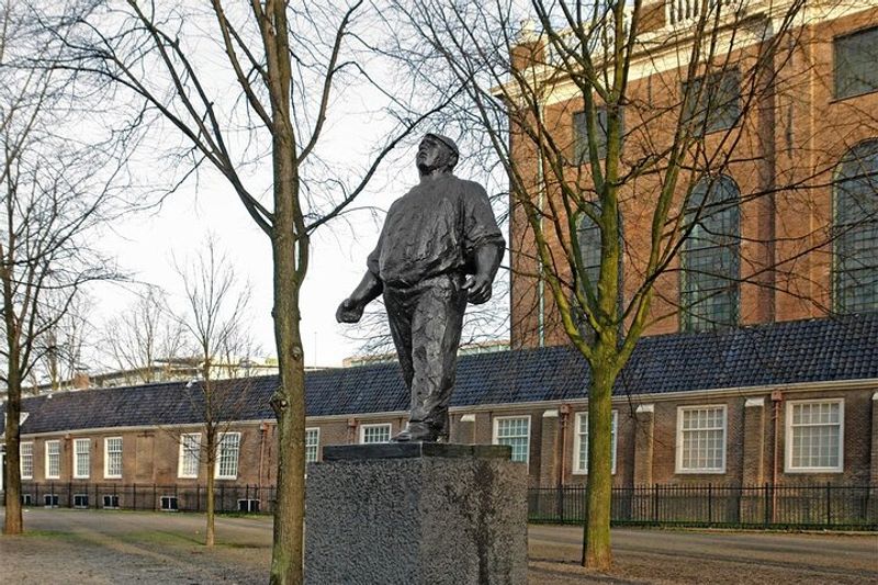 Amsterdam Private Tour - Dockworker statue near by Portuguese Synagogue (behind)