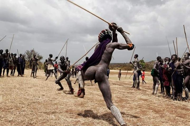 Addis Ababa Private Tour - Surma men performing stick fighting ceremony to conform they pass from boyhood to manhood 