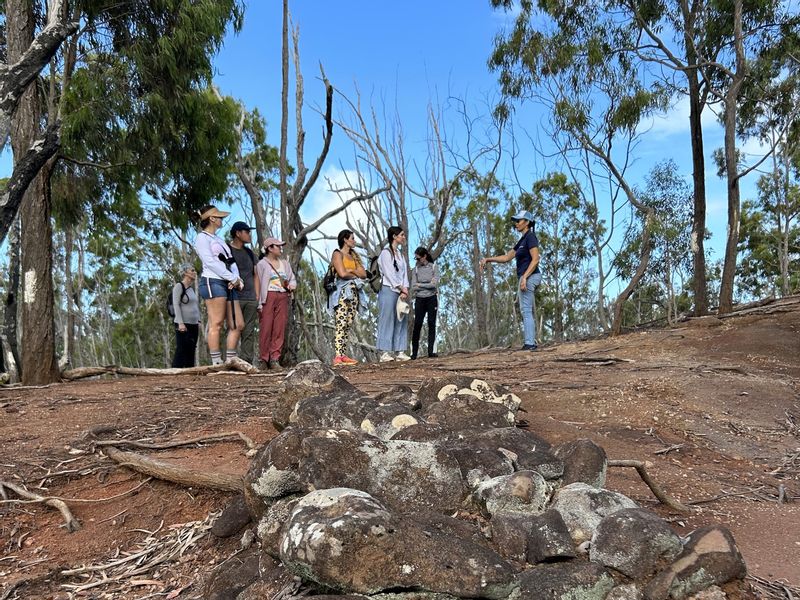 Hawaii (Oahu) Private Tour - Pausing on the hike to hear stories of the land. Archeological remnant in foreground.