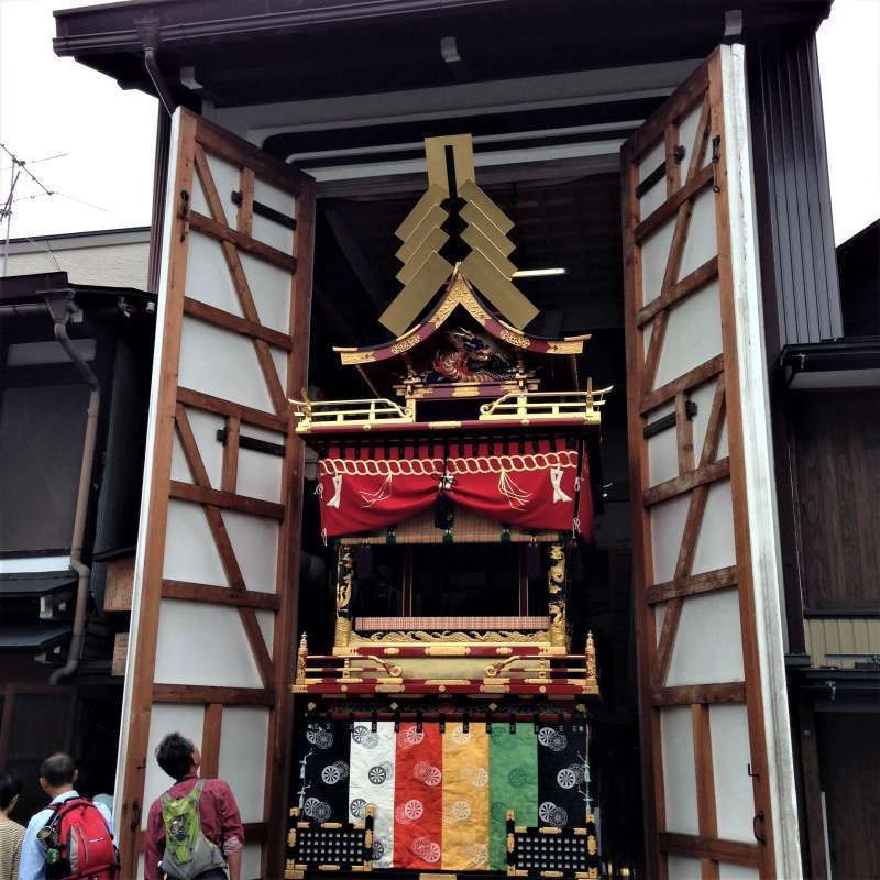 Gifu Private Tour - A big float is going out of a storehouse for the festival.