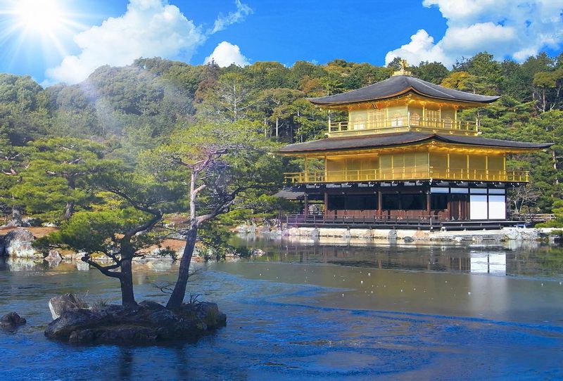 Kyoto Private Tour - Kinkakuji (金閣寺, Golden Pavilion) is a Zen temple in northern Kyoto whose top two floors are completely covered in gold leaf. Formally known as Rokuonji, the temple was the retirement villa of the shogun Ashikaga Yoshimitsu, and according to his will it became a Zen temple of the Rinzai sect after his death in 1408. Kinkakuji was the inspiration for the similarly named Ginkakuji (Silver Pavilion), built by Yoshimitsu's grandson, Ashikaga Yoshimasa, on the other side of the city a few decades later.