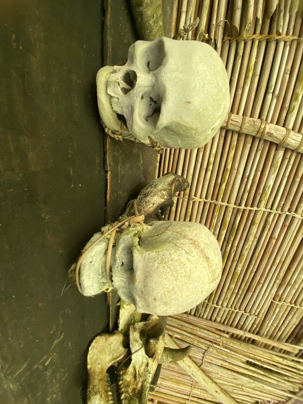 Manila Private Tour - Skull and bones collected by the locals of the village