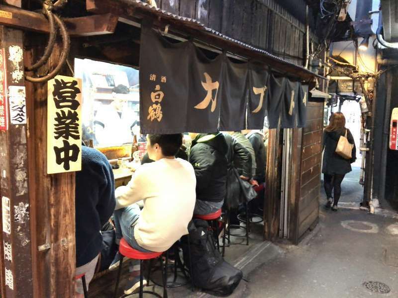 Tokyo Private Tour - A food stand at Omoide Yokocho Street in Shinjuku area