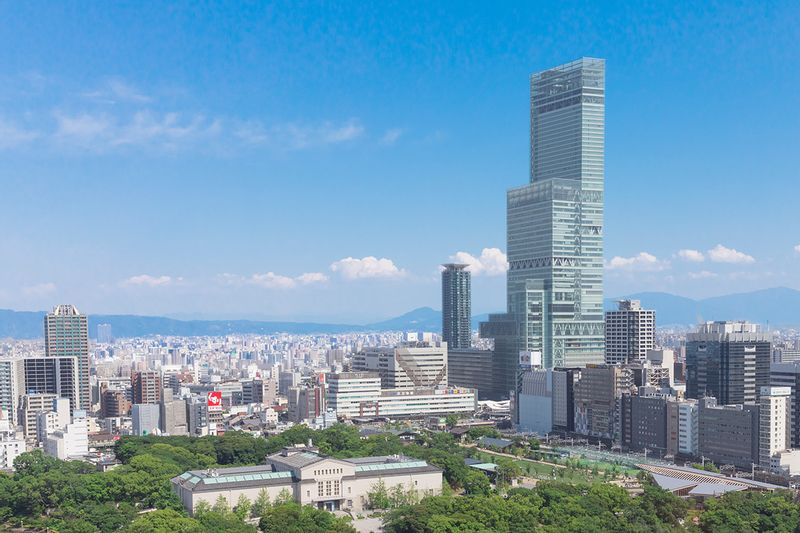 Osaka Private Tour - Standing 300 meters tall, Abeno Harukas (あべのハルカス) in Osaka was the tallest skyscraper in Japan from its completion in 2014 until 2023. The building stands on top of the Kintetsu Osaka Abenobashi Station and is conveniently located across from JR Tennoji Station. It houses a department store, an art museum, a hotel and an observation deck.
