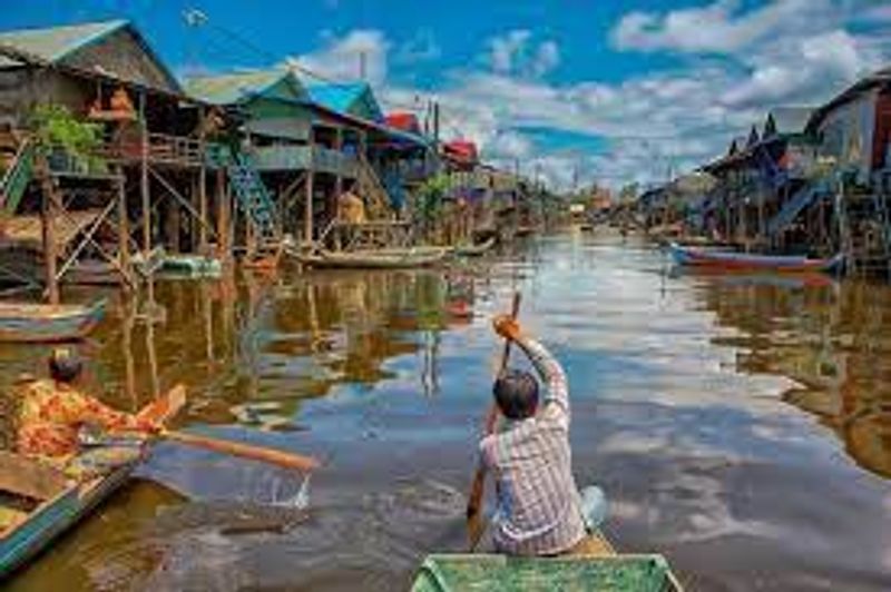 Siem Reap Private Tour - Villagers are rowing their boat in the village