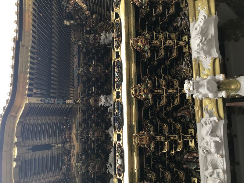 Nikko Private Tour - Intricate sculpture on one of the gates in Toshogu shrine.