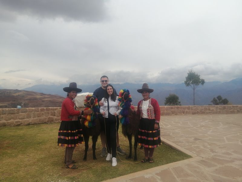 Cusco Private Tour - Interacting with a couple of local women and their cute llamas 