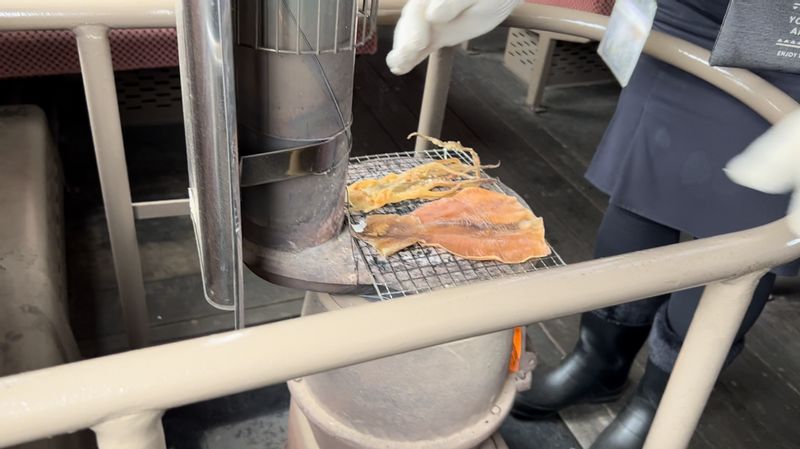 Aomori Private Tour - Dried squid can be cooked by attendants of Tsugaru railway