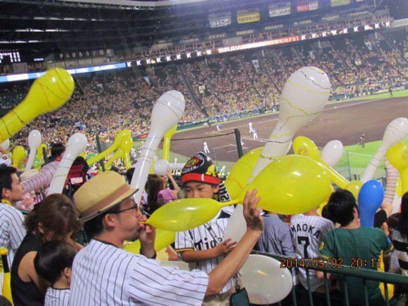 Osaka Private Tour - Supporters blow up balloons.