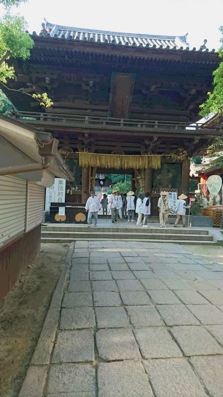 Ehime Private Tour - Nio-Mon. The gate of Ishiteji Temple, which was built in 1318. It is a national treasure. The two deva kings, or guardian gods, stand on both sides. They are said to be the works of Unkei, a famous sculptor of the 12th century. One on the right side with the open mouth symbolizes birth or beginning, and the other on the left with the closed mouth signifies death or end.