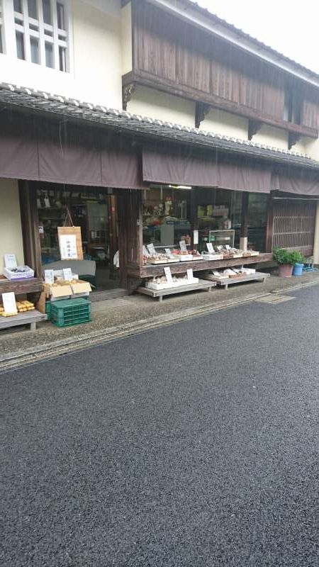 Ehime Private Tour - In front of a house agricultural produce is being sold.