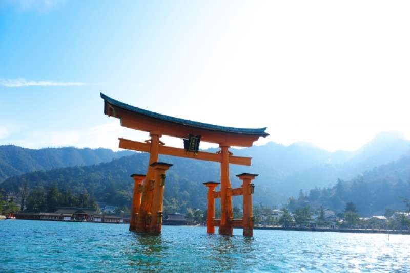 Hiroshima Private Tour - The centuries-old Itsukushima Shrine on Miyajima. The shrine and its torii gate are unique for being built over water, seemingly floating in the sea during high tide. It is outside Hiroshima city.