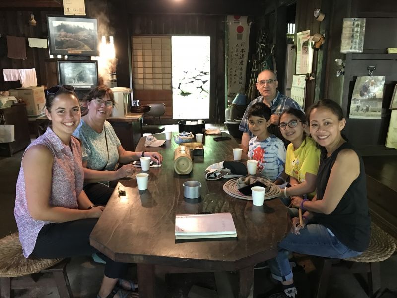 Gifu Private Tour - Travellers take rest  in the old cottage located in the middle of mountains along Nakasendo. They are enjoying chatting with other parties. They are served tea and sweets free by volunteer staff members.