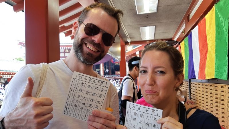 Tokyo Private Tour - Never mind with that! ( drawing the fortune paper at Sensoji temple)