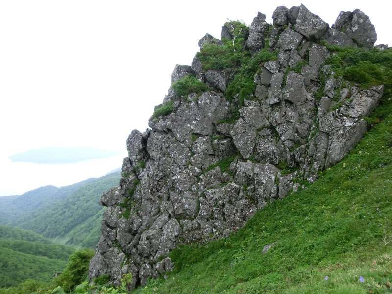 Shiretoko / Abashiri Private Tour - "Byobu-Iwa", which literally means "folding screen rock" in English, makes a beautiful contrast with gray rocks and green bamboo grass