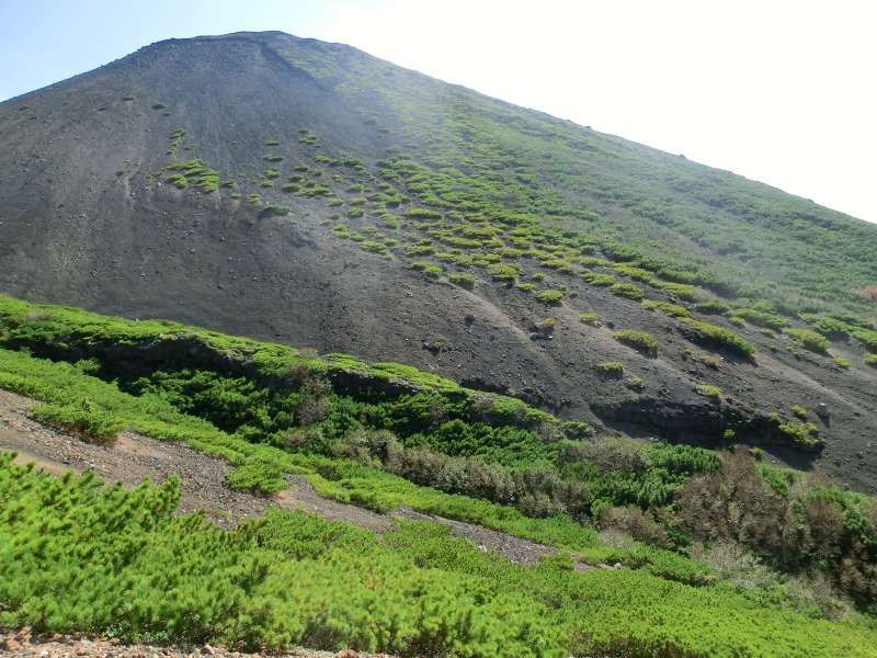 Shiretoko / Abashiri Private Tour - Mt. Akan-fuji , next to Mt. Meakan, looks so blackish because it is covered with volcanic gravel.