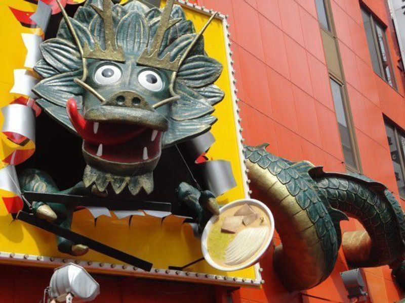 Osaka Private Tour - This signboard is a dragon of Kinryu Ramen.