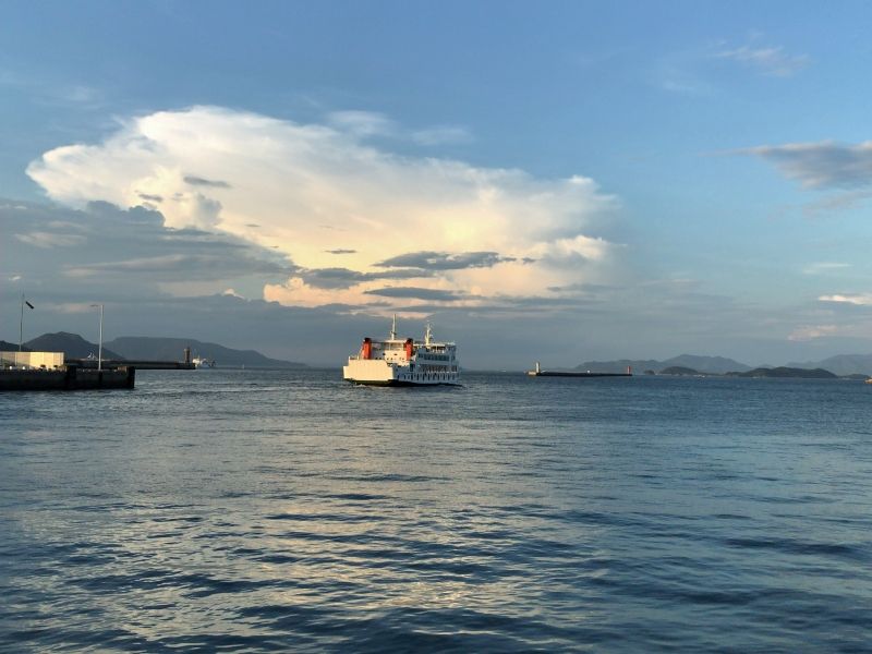 Kagawa Private Tour - A ferry connecting Takamatsu and Naoshima, with a beautiful sunset behind