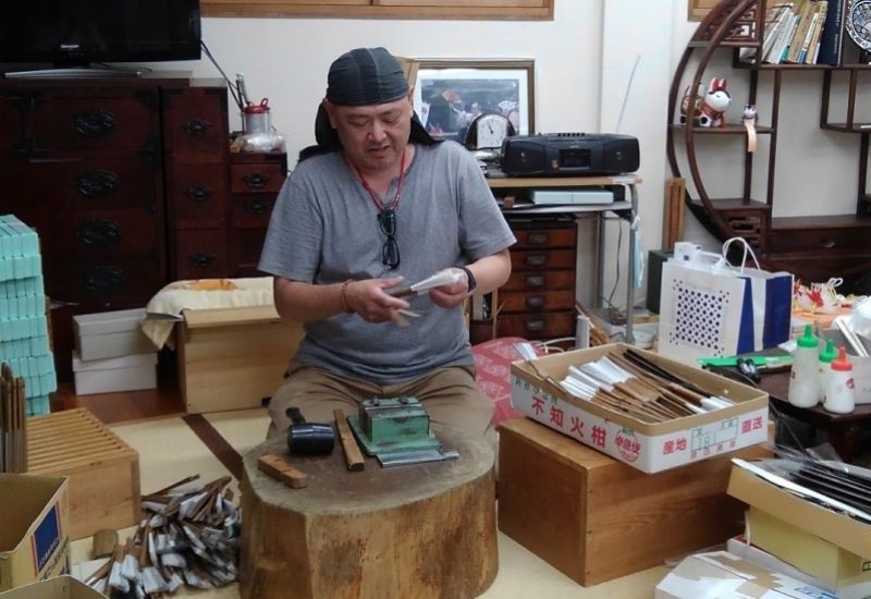 Nagoya Private Tour - He is a shop owner and a craftsman of making folding fan, he teaches you how to make a fan so politely. 