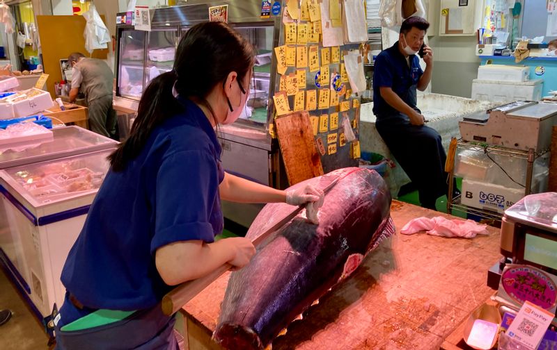 Tokyo Private Tour - If we are lucky, we will take a peek at a fishmonger slicing up tuna. (#1)