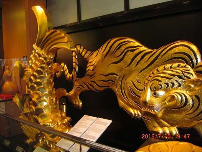 Osaka Private Tour - Golden dolphine-like and tiger guardians welcome you