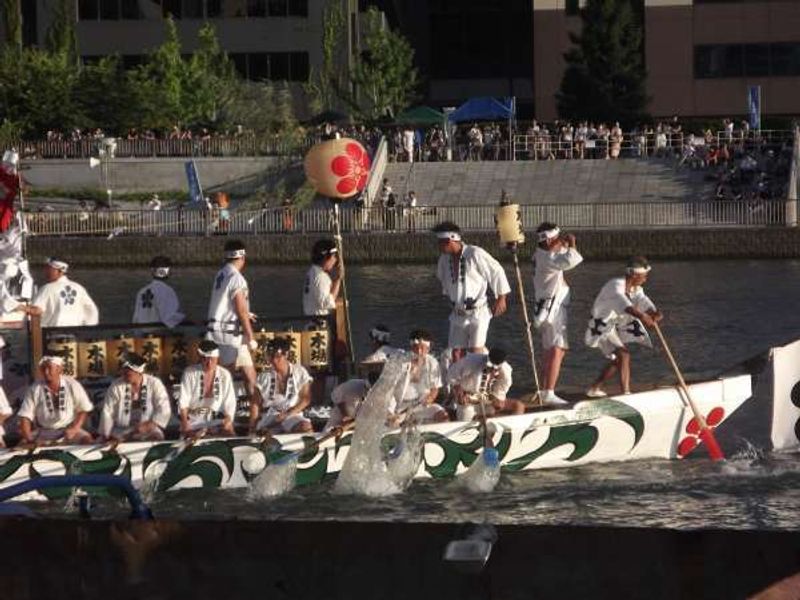 Osaka Private Tour - Raft with festival organizers on board.