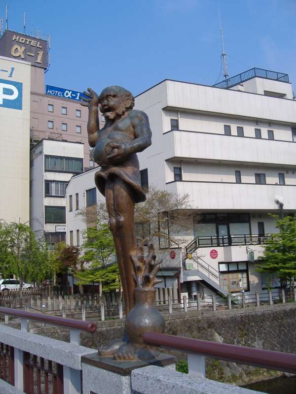 Gifu Private Tour - Ashinaga creature sculpture sits on the Kajibashi bridge railing.