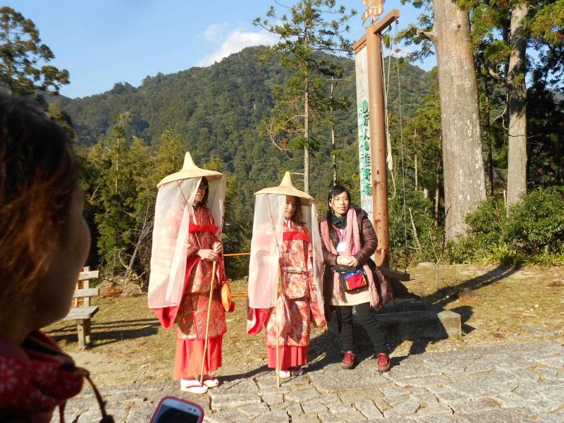 Wakayama Private Tour - Heian( ancient Japan) dress wearing women at the top of Daimon-zaka.