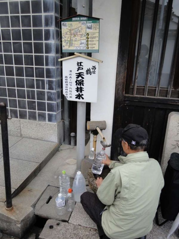 Hiroshima Private Tour - Local people are allowed to come and draw water from the wells of Sake makers. Well-water is free and open to everyone. 