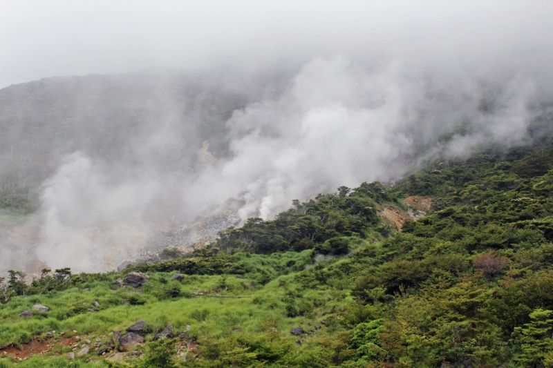 Tokyo Private Tour - Owakudani Valley.  You can see hot steams rising strongly from the mountainside.  Volcanic activity in Hakone is still very active.