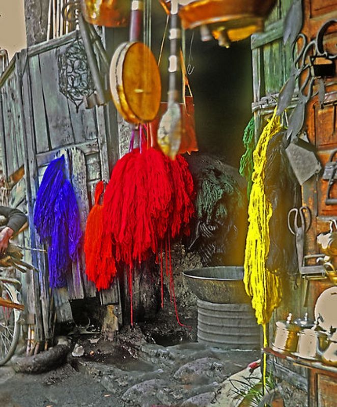 Marrakech Private Tour - A cramped darkened dyer's shop by smoke where nice colorful fibers of silk and wool are produced .
Dyers Market. 